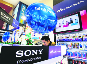 A man looks at Sony Corp products at an electronic store in Tokyo on Christmas. Sonys business in Asia, especially in China, has returned to levels seen before recent protests against Japans action over a group of islands. 