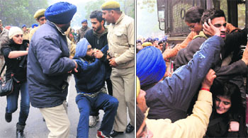 Youths protesting outside the Punjab Raj Bhavan being taken into police custody in Chandigarh on Tuesday. 