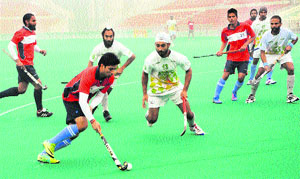 A match in progress during the SN Vohra All-India Gurmit Memorial Hockey Tournament at the hockey stadium in Sector 42, Chandigarh, on Tuesday.
