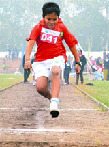 A student of Millennium School takes part in the annual athletics meet at the Sports Complex-7 in Chandigarh on Tuesday. 