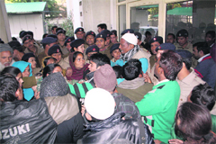 People hold a protest against the death of a boy allegedly due to a doctors negligence at Coronation Hospital in Dehradun on Tuesday.
