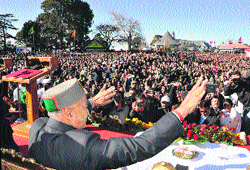 Virbhadra Singh waves to the crowd at the oath-taking ceremony in Shimla on Tuesday.
