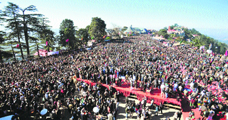 People throng to attend the oath taking ceremony of Chief Minister Virbhadra Singh in Shimla.