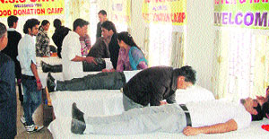People donate blood during a blood-donation camp at the Dronacharya College of Education, Rait. 
