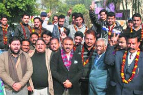 Jammu and Kashmir Democratic Front leaders pose for a photograph with new entrants in the party in Jammu on Tuesday