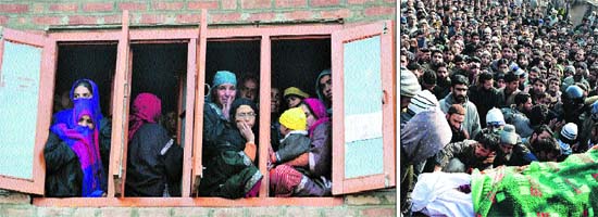 Women look out of a window to watch the funeral procession of Mudassir Ahmad Sheikh, a slain millitant. (Right) The body of Mudassir being carried by locals at Yamrach village in district Kulgam on Tuesday