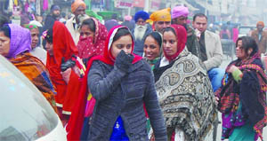 As fog clears up, residents throng markets in Amritsar on Wednesday. 