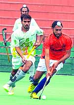 A hockey match between the Northern Railway and the Punjab Police in progress at Sector 42 in Chandigarh on Wednesday