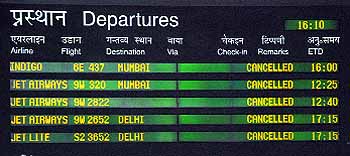 The departure schedule lists flights that were cancelled on Wednesday