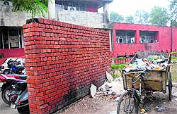Garbage dumped on the rear side of the foundation stone at the new MC building in Chandigarh