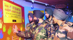 Soldiers of Sikh Battalion take an oath of abstaining from drugs at the Red Ribbon Express in Jalandhar on Wednesday.