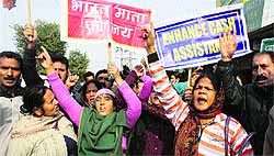 Kashmiri migrant relief holders voice their demands in Jammu on Wednesday