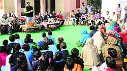 Reasi MLA Baldev Raj Sharma addresses a public darbar at Seela village on Wednesday