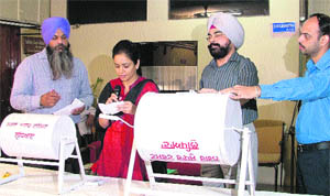 A draw of lots being conducted for the allotment of residential plot to eligible applicants at Shaheed Bhagat Singh Nagar in Ludhiana. 