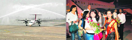 Maiden flight of SpiceJet from Delhi to Amritsar is being given water salute as it lands at the Sri Guru Ramdas Jee International Airport in Amritsar; and (right) officials of Armavia welcome the first batch of passengers from the Yaravan-Amritsar flight. 