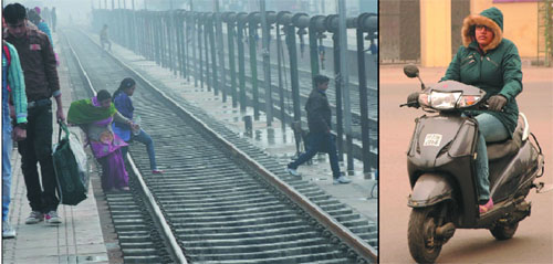 Unmindful of the risk involved, a woman along with her kids crosses the track at the railway station in Bathinda on a foggy Thursday; with icy winds blowing, commuters clad themselves well before venturing out of their homes. 