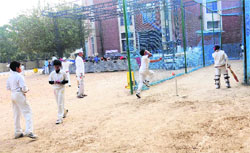 Players practise on an uneven turf at Saupins School, Sector 32, in Chandigarh. tribune photo: Manoj Mahajan