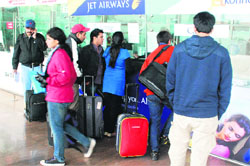 Passengers make enquiries at the Chandigarh airport. A Tribune photograph