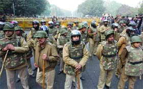 Delhi police personnel barricade a road leading to India Gate as the demonstrators take out a protest march against the Vasant Vihar gangrape, in New Delhi on Thursday