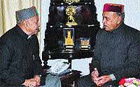 Virbhadra Singh meets PK Dhumal at Oakover in Shimla on Wednesday.