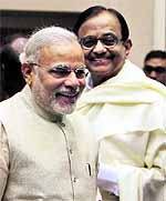 Gujarat Chief Minister Narendra Modi and Finance Minister P Chidambaram are all smiles at the NDC meeting in New Delhi on Thursday