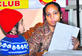 Accompanied by her daughter, Jaswinder Kaur, a resident of Malsiyan, narrates her woes to media while seeking justice from the police authorities in Jalandhar on Wednesday. 