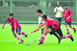 A match in progress between Amrit Academy Sansarpur and Jharkhar Academy Ludhiana at the opening of the 15th Steel Olymopian Mohinder Munshi Hockey tournament in PAP Jalandhar on Thursday.