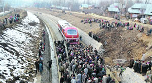 Villagers block the rail track at Qazigund on Thursday. 
