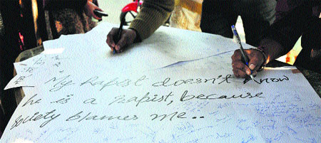 University scholars organise a signature campaign in protest against a barbaric gang rape in Delhi, in University of Jammu on Thursday.