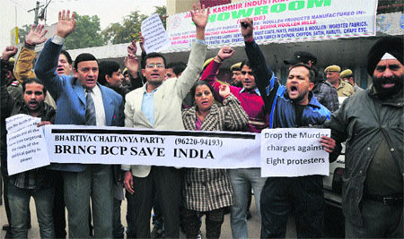 Members of Bhartiya Chaitanya Party stage a demonstration in Jammu on Thursday. They have called for dropping of murder charges against eight protesters.