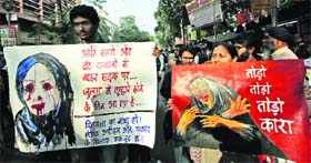 Students take part in a rally to protest against the Delhi gang rape and the recent rape cases reported in the state, in Kolkata on Thursday