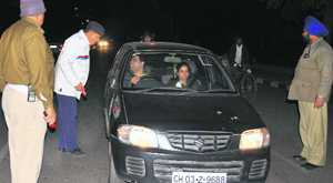 Policemen check for drunken driving at a barrier in Sector 22, Chandigarh, on Friday.
