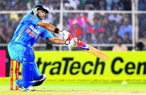 Man of the Match Yuvraj Singh hits one through the on side during the second Twenty20 match in Ahmedabad on Friday. 