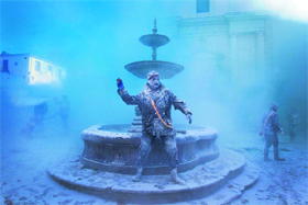 A man dressed in military uniform throws an egg as he takes part in the annual battle of "Enfarinats", a floor fight in the town of Ibi, in Spain on Friday. 