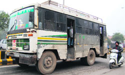 A bus with black films on windowpanes in Amritsar. Photo: Sameer Sehgal