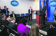 President Barack Obama stands at the lectern to make a statement to reporters after meeting with congressional leaders at the White House in Washington on Friday. Obama held out hope for a last-minute agreement to avoid the fiscal cliff of tax increases and spending cuts after a meeting with congressional leaders, scolding Congress for leaving the problem unresolved until the eleventh hour.