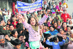 Residents shout slogans against the central government during a protest after the death of the Delhi gang rape victim in Karnal. 
