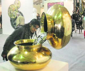 Creative trail: A visitor admires Subodh Guptas Cascading Water at the India Art Fair in New Delhi