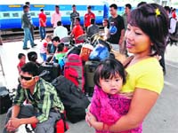 Flight & fright: A rumour, circulated through SMS and MMS, spurred the exodus of thousands of North-Eastern people from Bangalore