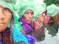 Watery protest: Inhabitants of the villages that were to be engulfed by the Narmada dam protested by standing in water
