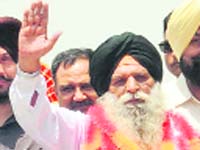 Home at last: Surjit Singh, jailed in Pakistan for 30 years on charges of espionage, returned home to an arousing welcome at the Wagah border
