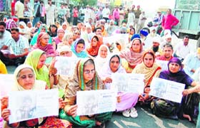 Relatives of 10-year-old Gurkirat Singh, who was kidnapped and murdered, hold a protest rally