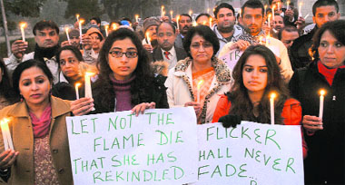 Members of the Panjab University Teachers Association hold a candlelight march on the PU campus to pay tributes to the Delhi gang rape victim in Chandigarh on Sunday.