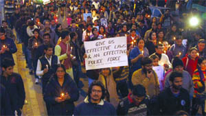 Teachers and students of Delhi University take out a candlelight vigil to pay homage to the gangrape victim on DU campus in New Delhi on Sunday. 