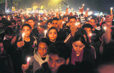 Protesters hold candles during a rally in New Delhi on December 29 following the death of a gang rape victim. 