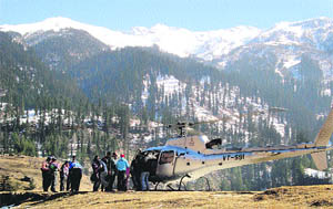 A helicopter takes off with visitors at Kothi, 12 km from Manali, on Sunday. 