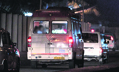 The 23-year-old Delhi gang-rape victim's body being taken in an ambulance after arrival at AFS Palam in New Delhi on Sunday morning.