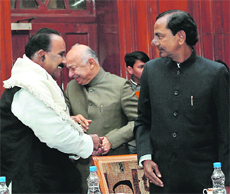 Union Home Minister Sushil Kumar Shinde at the December 28 all-party @@meeting on the Telangana issue in New Delhi. TRS president K Chandrasekhar Rao (right) and party leader Naidi Narsimha Reddy are also seen.