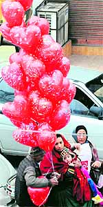 A balloon seller tries to cash in on the celebration mood on New Years Eve in Amritsar on Monday