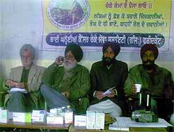 Members of the NGO, Bhai Kanhia Cancer Roko Sewa Society, showing medicines which have 1000 per cent more MRP printed than the actual price